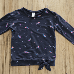 Navy blue long-sleeve shirt with pink flamingo prints and a front tie knot.