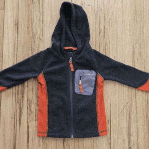 Children's fleece jacket with hood in dark and orange tones.