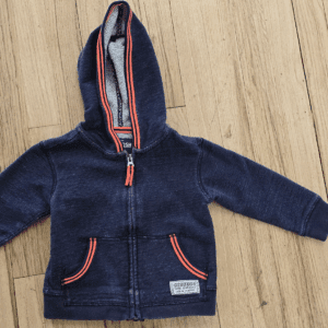 Navy blue toddler hoodie with orange trimmed zipper and pockets.