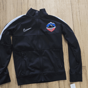 Black Nike sports jacket with a colorful patch on the chest.
