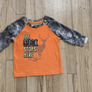 Orange and black kids' shirt with 'The Rock Stops Here' text and a handprint design.