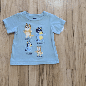 Light blue toddler t-shirt with four cartoon dog characters and names.