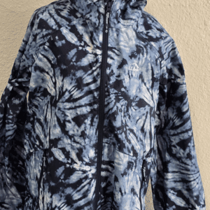 Black and white patterned zip-up hoodie on a mannequin.